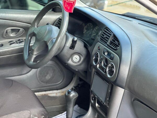 MITSUBISHI SIGNO GLX 2009 MARRON - Imagen 6